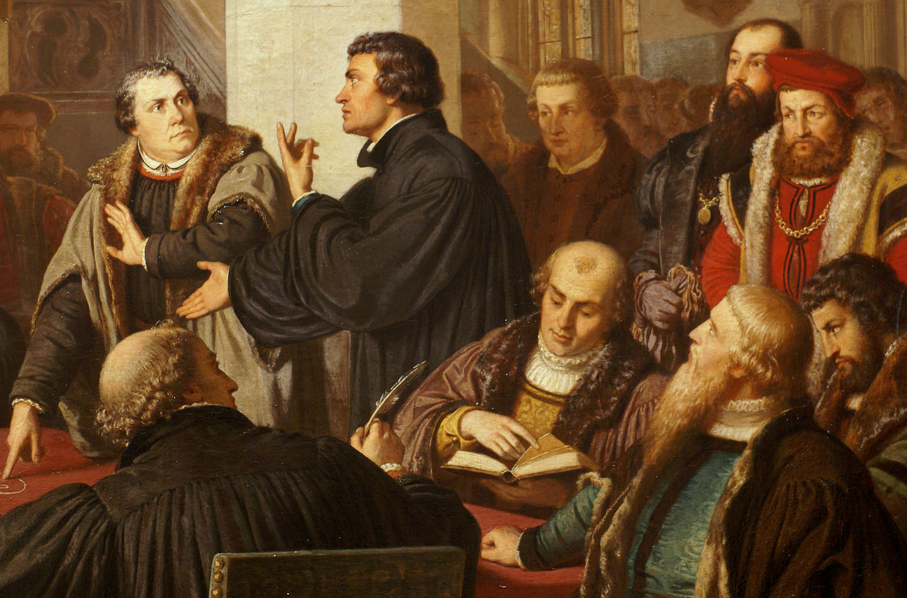 Luther und Zwingli trafen sich mit ihren Delegationen 1529 in Marburg, um ihre Differenzen zu bereinigen. Das gelang in allen Punkten – ausser in der Frage vom Abendmahl. Gemälde von August Noack, 1867.